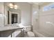 Bright bathroom features a shower and tub combination and vanity with marble countertop at 18 Blackland Nw Rd, Atlanta, GA 30342