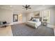 A beautifully appointed bedroom with a patterned rug, neutral color scheme, and ample natural light at 18 Blackland Nw Rd, Atlanta, GA 30342