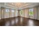 Spacious bedroom with decorative tray ceiling, hardwood floors and large windows at 18 Blackland Nw Rd, Atlanta, GA 30342