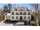 Stunning white brick home featuring multiple balconies and a manicured front yard at 18 Blackland Nw Rd, Atlanta, GA 30342