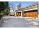 Spacious two-car garage with wooden doors and a large driveway for parking at 18 Blackland Nw Rd, Atlanta, GA 30342