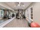 Spacious home gym with mirrors, ample natural light, and a variety of fitness equipment at 18 Blackland Nw Rd, Atlanta, GA 30342