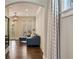 Hallway featuring hardwood floors, modern light fixture and access to balcony at 18 Blackland Nw Rd, Atlanta, GA 30342