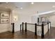 Hallway featuring hardwood floors, detailed trim work, and stylish lighting fixtures at 18 Blackland Nw Rd, Atlanta, GA 30342