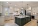 Spacious kitchen with a large island, white cabinets, and stainless steel appliances at 18 Blackland Nw Rd, Atlanta, GA 30342