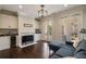 Cozy living room with fireplace, white cabinets, and french doors leading to outdoor seating at 18 Blackland Nw Rd, Atlanta, GA 30342