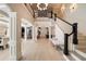 Spacious living room with an elegant staircase and lots of natural light at 18 Blackland Nw Rd, Atlanta, GA 30342