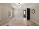 Bright room with light wood floors, modern trim, and a large window with a view at 18 Blackland Nw Rd, Atlanta, GA 30342