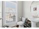 Well-lit half bathroom featuring a pedestal sink, modern fixtures, and a window for fresh light at 2145 Old Georgian Nw Ter, Atlanta, GA 30318