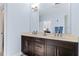 Bathroom featuring double sink vanity and a large mirror at 2145 Old Georgian Nw Ter, Atlanta, GA 30318