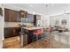 Modern kitchen with stainless steel appliances, granite countertops, and a center island with bar seating at 2145 Old Georgian Nw Ter, Atlanta, GA 30318