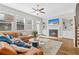 This bright living room boasts hardwood floors, a fireplace with built-ins, and comfortable seating at 2145 Old Georgian Nw Ter, Atlanta, GA 30318