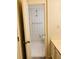 Bathroom view through a doorway, showing a toilet, sink, and patterned wallpaper at 25108 Plantation Dr # 108, Atlanta, GA 30324