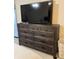 Bedroom view featuring a rustic dresser with a mounted TV at 25108 Plantation Dr # 108, Atlanta, GA 30324