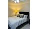 Simple bedroom with a full bed, geometric pillows, and overhead fan lighting at 25108 Plantation Dr # 108, Atlanta, GA 30324