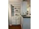 Eat-in kitchen with built-in shelving and lower cabinets on hardwood floors at 25108 Plantation Dr # 108, Atlanta, GA 30324