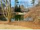 View of the pond with surrounding trees and building in background at 25108 Plantation Dr # 108, Atlanta, GA 30324