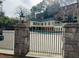 Community pool area with decorative fence at 25108 Plantation Dr # 108, Atlanta, GA 30324