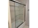 Shower stall with glass doors, tile walls, and chrome hardware at 25108 Plantation Dr # 108, Atlanta, GA 30324