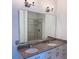 Bathroom featuring double sinks, a large mirror, and a walk-in shower at 384 Ralph Mcgill Ne Blvd # 121, Atlanta, GA 30312