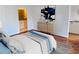 Bedroom showcasing stylish decor, hardwood floors, and ample natural light at 384 Ralph Mcgill Ne Blvd # 121, Atlanta, GA 30312