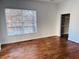 A bright bedroom has wood floors, a large window, and a spacious closet at 384 Ralph Mcgill Ne Blvd # 121, Atlanta, GA 30312