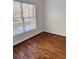 A bright bedroom features wood floors and a large window at 384 Ralph Mcgill Ne Blvd # 121, Atlanta, GA 30312