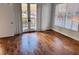 Bedroom with wood floors, large windows, and balcony doors at 384 Ralph Mcgill Ne Blvd # 121, Atlanta, GA 30312