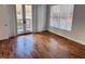 Bedroom features natural light with an attached balcony and wood flooring at 384 Ralph Mcgill Ne Blvd # 121, Atlanta, GA 30312