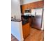 Kitchen with stainless steel appliances, stone countertop, and bar at 384 Ralph Mcgill Ne Blvd # 121, Atlanta, GA 30312