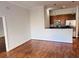 View of open-concept living area to kitchen with hardwood flooring at 384 Ralph Mcgill Ne Blvd # 121, Atlanta, GA 30312