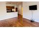 Open-concept living area with hardwood floors that flow to the kitchen at 384 Ralph Mcgill Ne Blvd # 121, Atlanta, GA 30312