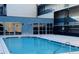 Inviting outdoor pool area with clear blue water, surrounded by a concrete deck and modern building at 384 Ralph Mcgill Ne Blvd # 121, Atlanta, GA 30312