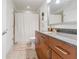 Bright bathroom with a wood vanity, granite countertop, and shower-tub combo at 44 Peachtree Ne Pl # 829, Atlanta, GA 30309