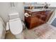 Bathroom featuring a modern toilet and a vanity with a granite countertop at 44 Peachtree Nw Pl # 829, Atlanta, GA 30309