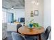 Cozy dining area with round table, modern lighting, and open view to living room at 44 Peachtree Ne Pl # 829, Atlanta, GA 30309