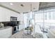 Contemporary kitchen features stainless steel appliances, black backsplash, modern lighting, and a beautiful marble countertop at 44 Peachtree Ne Pl # 829, Atlanta, GA 30309