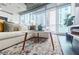 Comfortable living room features a stylish rug, modern furniture, and large windows offering plenty of natural light at 44 Peachtree Nw Pl # 829, Atlanta, GA 30309