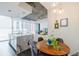 Open living space featuring kitchen, dining area and living room with city views at 44 Peachtree Ne Pl # 829, Atlanta, GA 30309