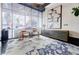 Modern lobby with a sitting area, large windows, statement art and furniture, and a striking rug at 44 Peachtree Ne Pl # 829, Atlanta, GA 30309