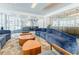 Lounge area with couches and tables with large windows overlooking the city at 44 Peachtree Ne Pl # 829, Atlanta, GA 30309