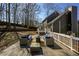 Comfortable outdoor seating arrangement with a fire pit on the wooden deck at 452 Springfield Dr, Woodstock, GA 30188