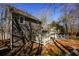 Back yard showing the deck, mature trees, and landscaping at 452 Springfield Dr, Woodstock, GA 30188