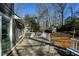 Backyard deck area featuring gray siding, white railings and a wooden shed at 452 Springfield Dr, Woodstock, GA 30188