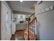 Inviting entryway features hardwood floors, staircase with iron spindles, and a view into the spacious living room at 452 Springfield Dr, Woodstock, GA 30188