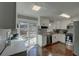 Kitchen featuring granite counters, stainless appliances, mosaic backsplash and sliding door to the back deck at 452 Springfield Dr, Woodstock, GA 30188