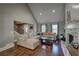 Bright and open living room showcases a vaulted ceiling, a stone fireplace, and hardwood floors for comfortable living at 452 Springfield Dr, Woodstock, GA 30188