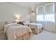 Neutral-toned bedroom with two beds, soft natural light, and classic decor at 2805 N Hills Ne Dr, Atlanta, GA 30305