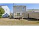 View of backyard with wooden deck and stairwell on a sunny day at 543 Harbor Lake Ct, Marietta, GA 30066