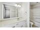 Bright bathroom boasts large white vanity, tile floors, and combined shower and tub at 543 Harbor Lake Ct, Marietta, GA 30066